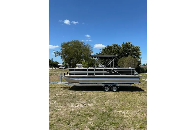 Slide: The Image of 2026 Bentley Pontoons Fish 243 4-Point on trailer outdoors. - 25