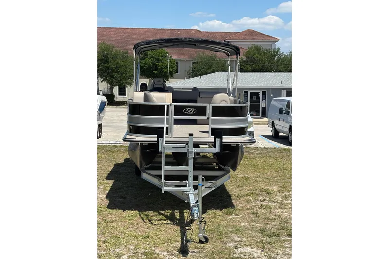 Slide: The Image of 2026 Bentley Pontoons Fish 243 4-Point on trailer, sunny day. - 5