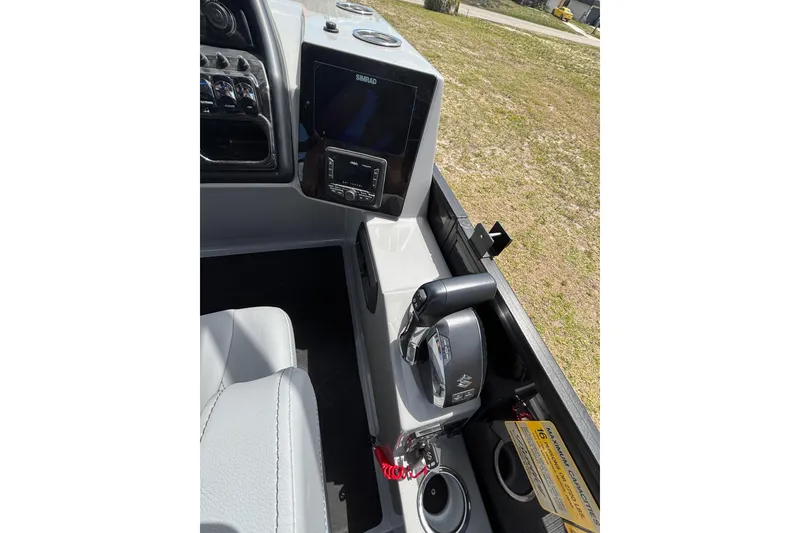 Slide: The Image of Interior view of Bentley Pontoons Elite 253 Swingback 2026 helm. - 12