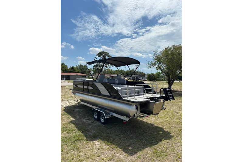 Slide: The Image of 2026 Bentley Pontoons Elite 253 Swingback on trailer outdoors. - 18