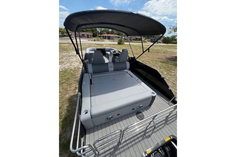 Slide: The Image of 2026 Bentley Pontoons Elite 253 Swingback with gray interior and sunshade. - 19