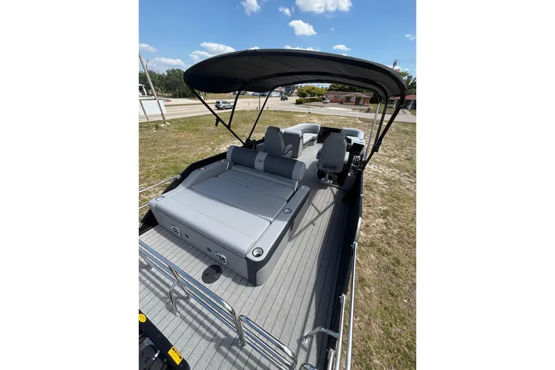 Slide: The Image of 2026 Bentley Pontoons Elite 253 Swingback with gray interior and sunshade. - 20