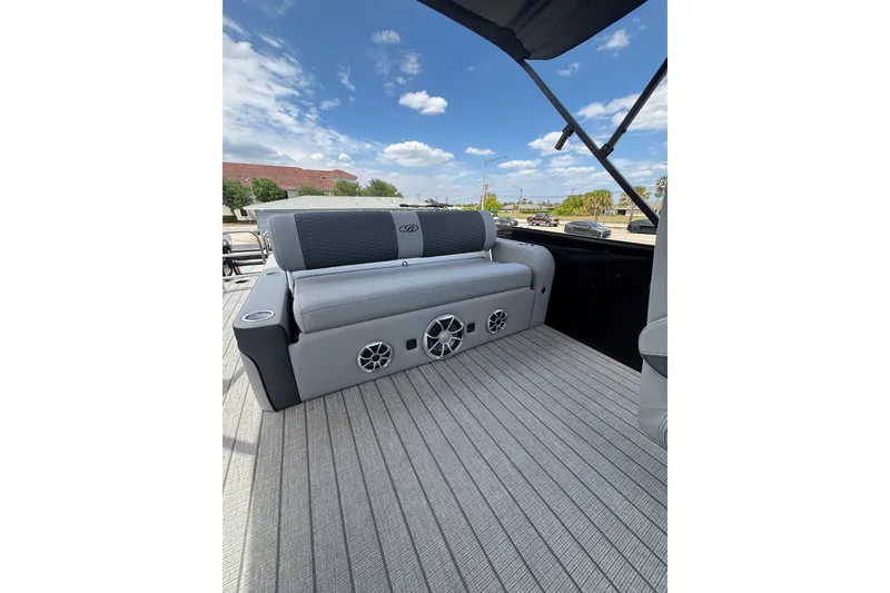 Slide: The Image of 2026 Bentley Pontoons Elite 253 Swingback with gray interior and speakers. - 8