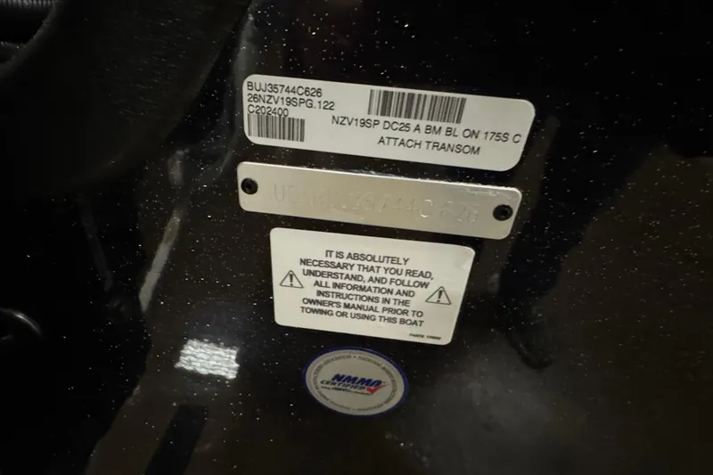 Slide: The Image of Close-up of Nitro ZV19 Sport Pro 2026 boat identification and warning labels. - 4