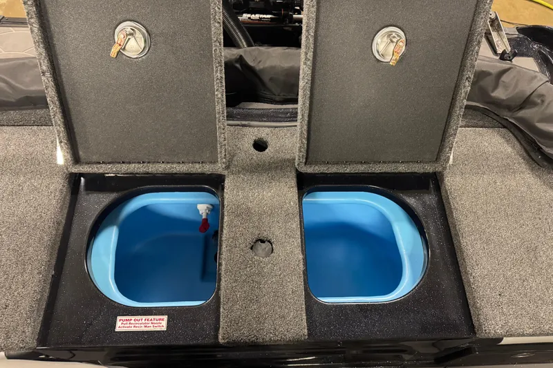 Slide: The Image of 2026 Nitro ZV19 Sport Pro boat storage compartments with blue interior and secure locks. - 9