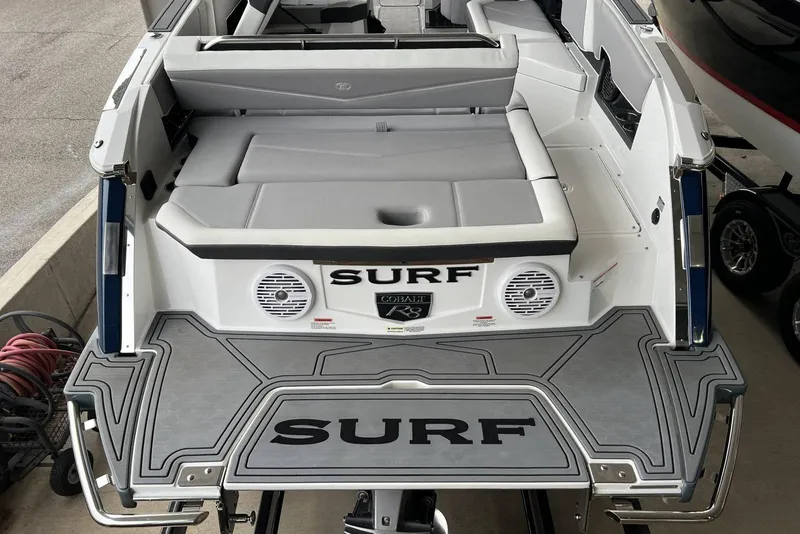 Slide: The Image of 2022 Cobalt R8 Surf boat with spacious seating and sleek design. - 16