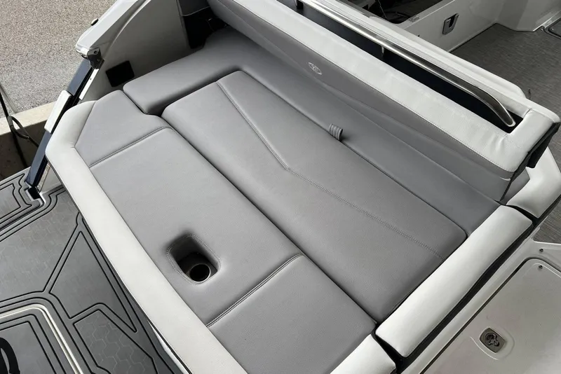 Slide: The Image of 2022 Cobalt R8 Surf boat with sleek gray seating and integrated cup holder. - 17