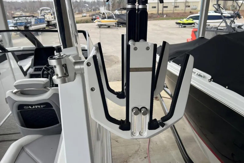 Slide: The Image of 2022 Cobalt R8 Surf boat interior with wakeboard rack and seating. - 18