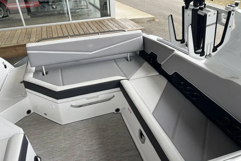 Slide: The Image of 2022 Cobalt R8 Surf boat interior with sleek gray seating and modern design. - 19