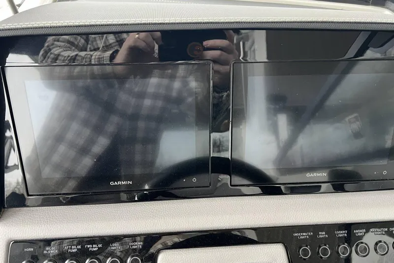 Slide: The Image of Dual Garmin screens on 2022 Cobalt R8 Surf boat dashboard. - 24