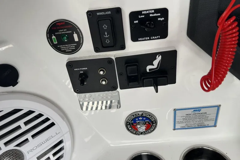 Slide: The Image of Control panel of 2022 Cobalt R8 Surf boat with various switches and labels. - 27