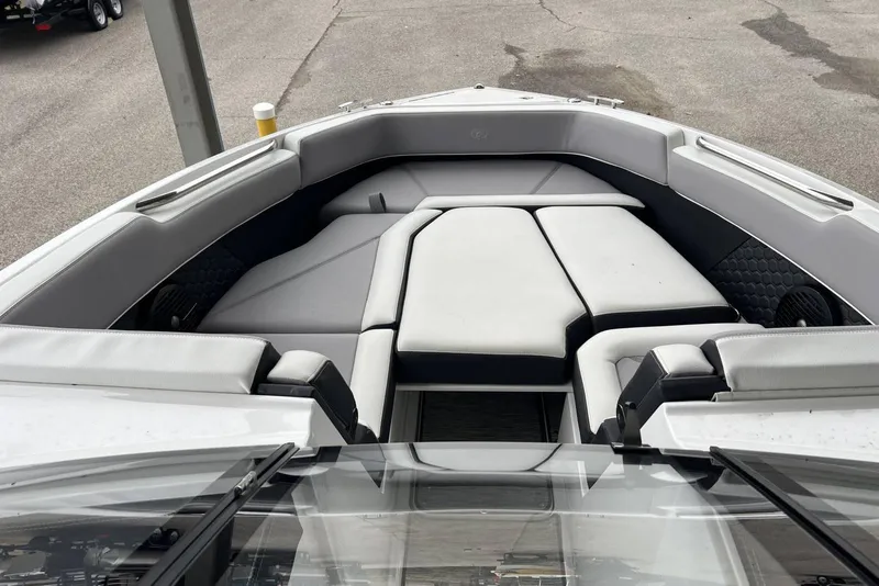 Slide: The Image of 2022 Cobalt R8 Surf boat interior with cushioned seating and sleek design. - 28