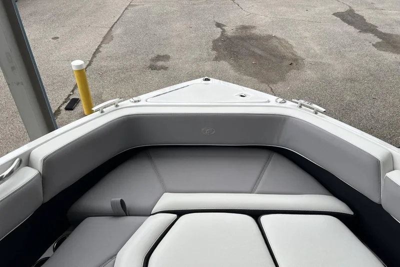 Slide: The Image of 2022 Cobalt R8 Surf boat interior with gray seating and sleek design. - 29