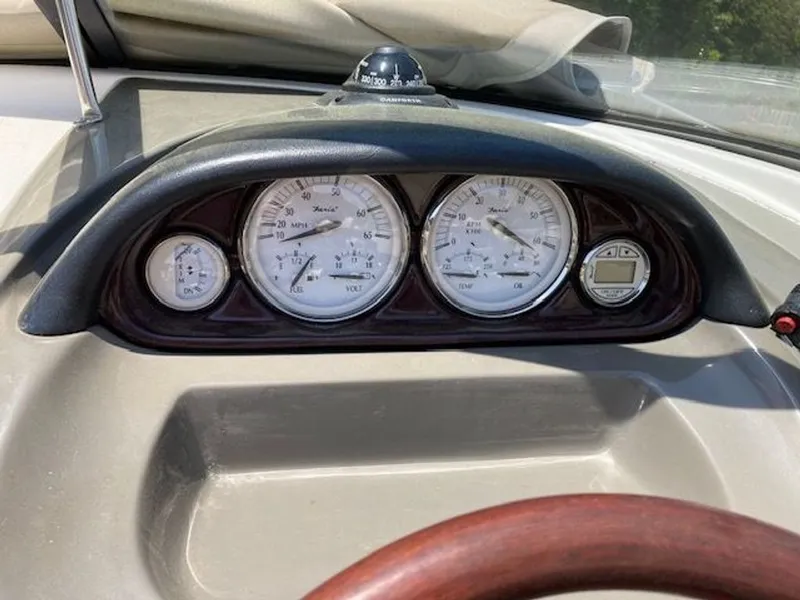 Slide: The Image of Dashboard of a 2009 Regal 2450 Cuddy boat with instruments. - 10
