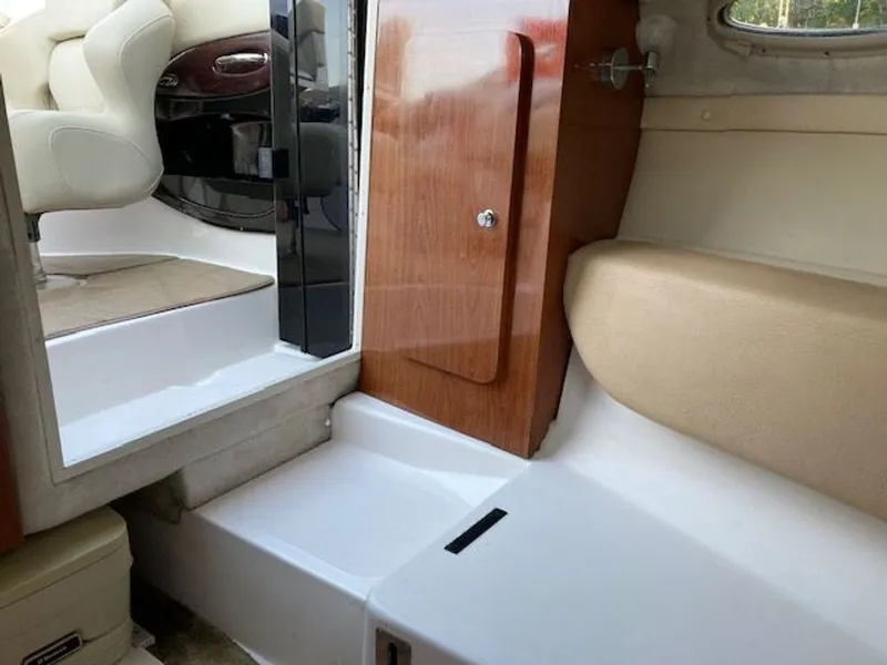 Slide: The Image of Interior of 2009 Regal 2450 Cuddy boat with seating area. - 19