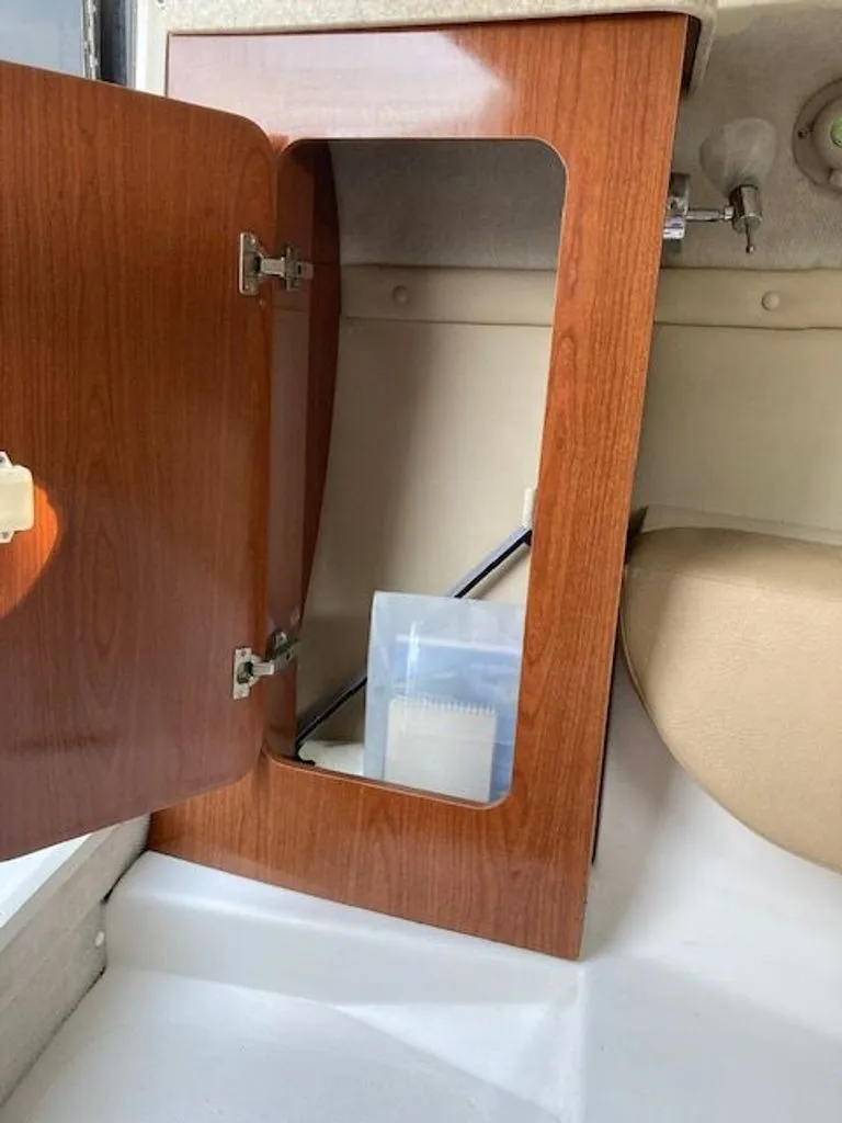 Slide: The Image of Open cabinet in 2009 Regal 2450 Cuddy boat. - 20