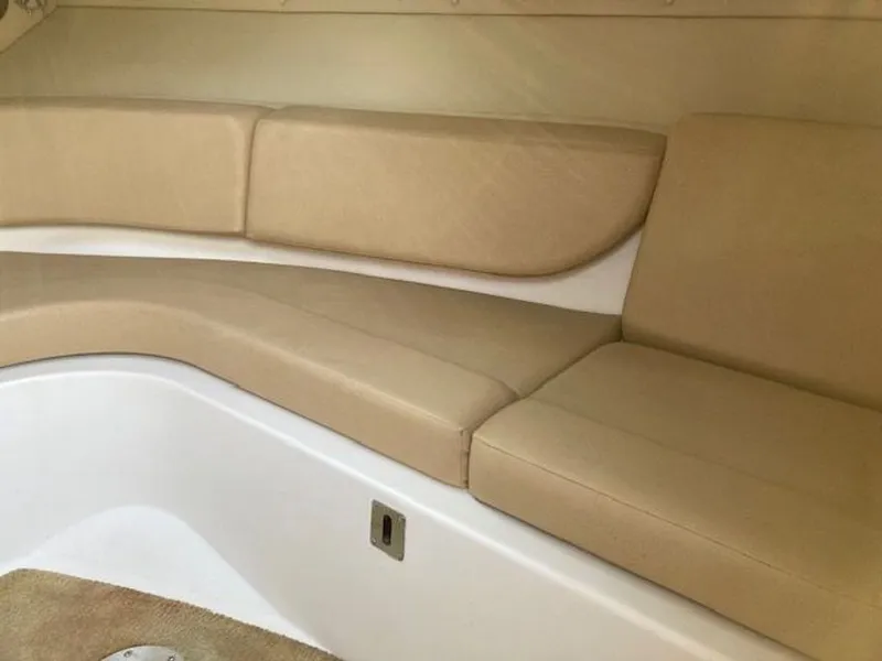 Slide: The Image of Interior of 2009 Regal 2450 Cuddy with beige upholstery. - 24