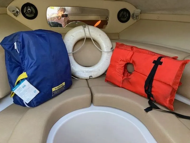 Slide: The Image of Interior of a 2009 Regal 2450 Cuddy boat with life jackets. - 27