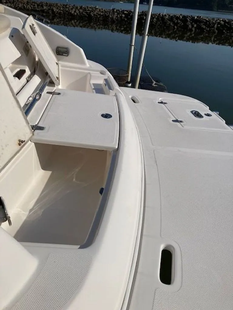 Slide: The Image of Regal 2450 Cuddy 2009 boat with open storage on deck. - 31
