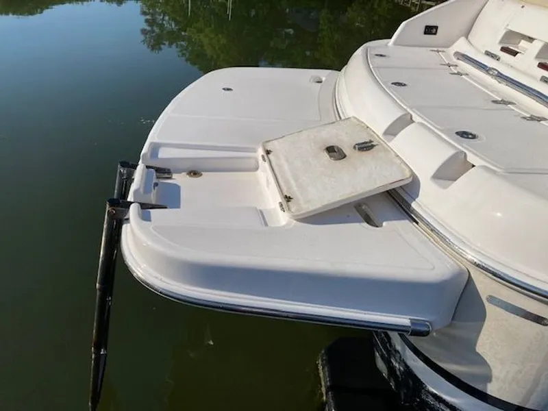 Slide: The Image of Rear view of a 2009 Regal 2450 Cuddy boat with swim platform. - 34