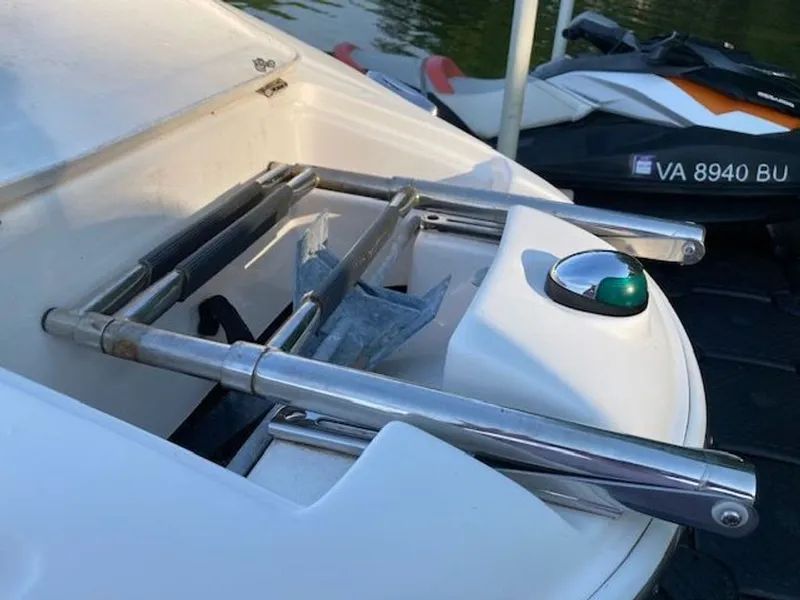 Slide: The Image of Regal 2450 Cuddy 2009 boat with stainless steel ladder and navigation light. - 35