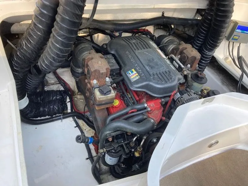 Slide: The Image of Engine compartment of a 2009 Regal 2450 Cuddy boat. - 39