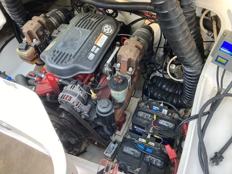 Slide: The Image of Engine compartment of a 2009 Regal 2450 Cuddy boat with batteries. - 40