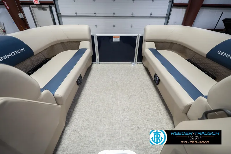 Slide: The Image of Interior of 2026 Bennington 21 SLJ pontoon boat with beige and blue seating. - 17