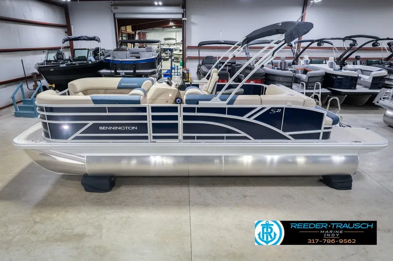 The Image of 2026 Bennington 21 SLJ pontoon boat in showroom, side view. - 2