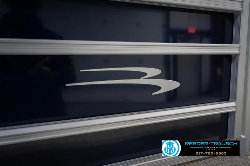 Slide: The Image of 2026 Bennington 21 SLJ boat detail with logo, Reeder Trausch Marine branding. - 44