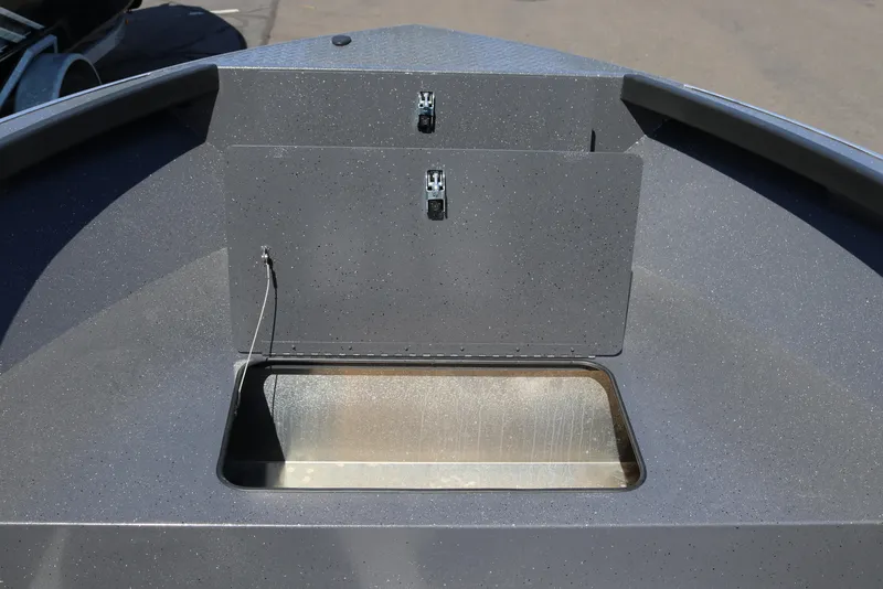 Slide: The Image of 2026 Alumaweld Adventurer 20 boat interior with storage compartment open. - 11