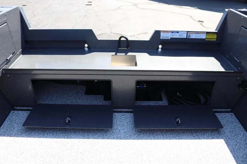 Slide: The Image of 2026 Alumaweld Adventurer 20 boat interior with storage compartments open. - 15