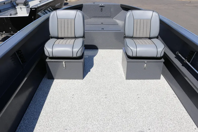 Slide: The Image of 2026 Alumaweld Adventurer 20 boat interior with two gray seats on storage boxes. - 3