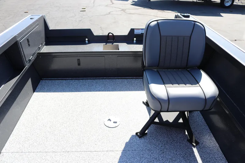 Slide: The Image of 2026 Alumaweld Adventurer 20 boat interior with a single gray seat on a speckled floor. - 9