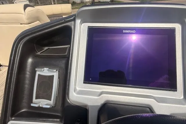 Slide: The Image of Dashboard of 2021 Premier 250 Grand Majestic RF with Simrad display and speaker. - 10