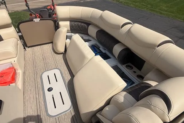 Slide: The Image of Luxurious seating on 2021 Premier 250 Grand Majestic RF pontoon boat, featuring beige upholstery. - 12