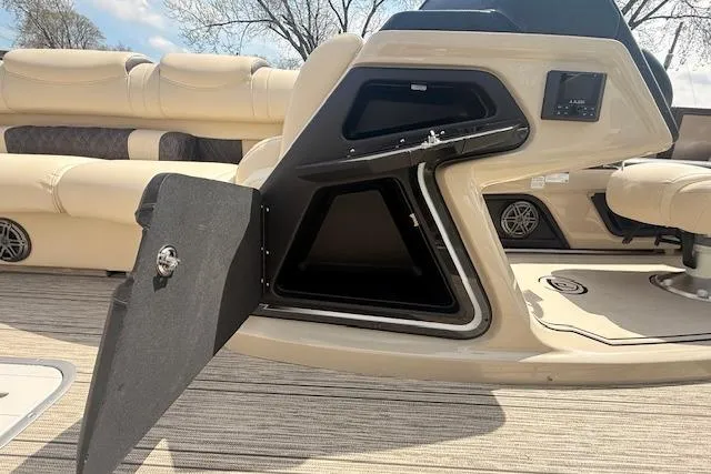 Slide: The Image of 2021 Premier 250 Grand Majestic RF boat interior with open storage compartment. - 14
