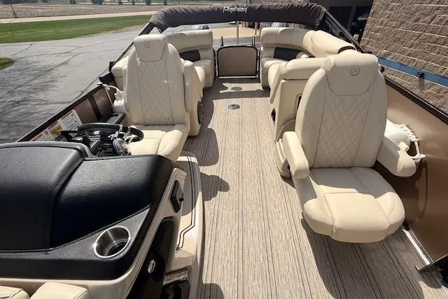 Slide: The Image of Luxurious 2021 Premier 250 Grand Majestic RF pontoon boat with plush seating and elegant design. - 15