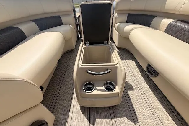 Slide: The Image of Interior of 2021 Premier 250 Grand Majestic RF boat with beige seating and storage compartment. - 17