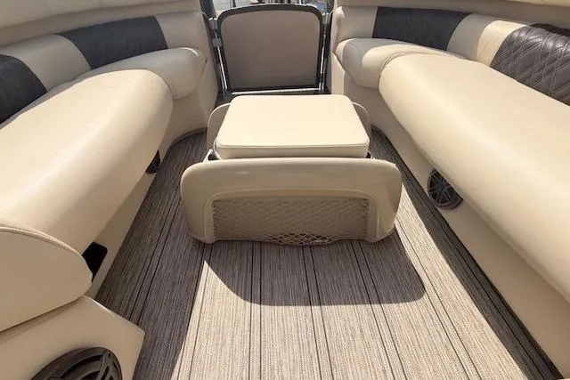 Slide: The Image of Interior of 2021 Premier 250 Grand Majestic RF boat with beige seating and flooring. - 18