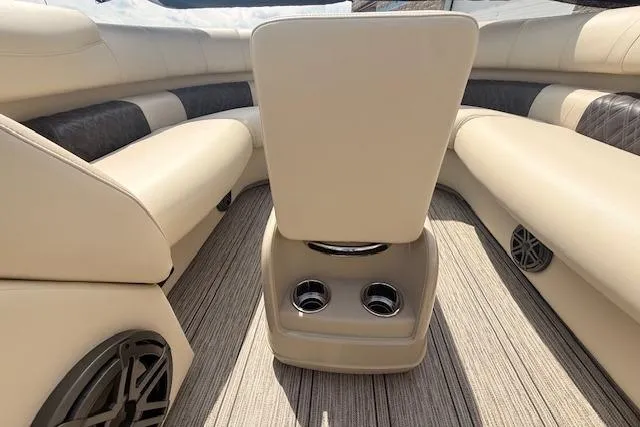 Slide: The Image of Luxurious interior of 2021 Premier 250 Grand Majestic RF boat with beige seating and cup holders. - 19