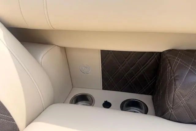 Slide: The Image of Luxurious interior of 2021 Premier 250 Grand Majestic RF with cup holders and quilted leather accents. - 21