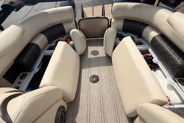 Slide: The Image of Luxurious interior of 2021 Premier 250 Grand Majestic RF pontoon boat with beige seating. - 24