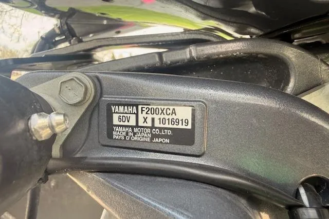 Slide: The Image of Yamaha F200XCA engine label on a 2021 Premier 250 Grand Majestic RF boat. - 26