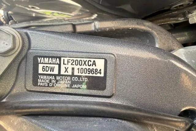 Slide: The Image of Close-up of Yamaha LF200XCA engine label, made in Japan, on a 2021 Premier 250 Grand Majestic RF. - 27