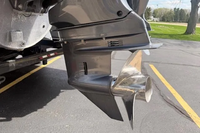Slide: The Image of Close-up of a 2021 Premier 250 Grand Majestic RF boat propeller in a parking lot. - 28