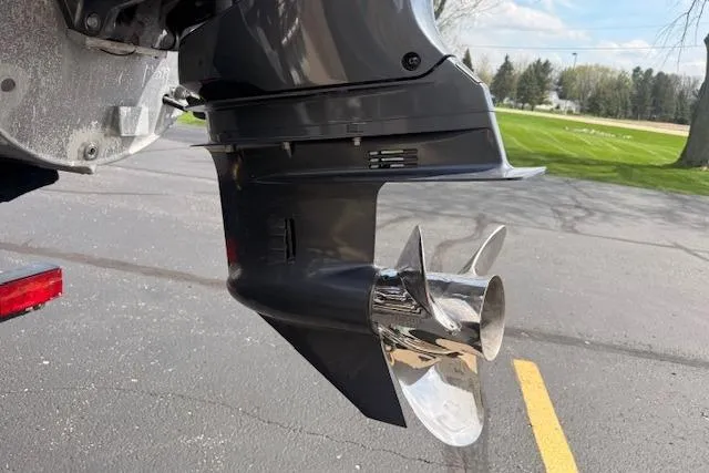 Slide: The Image of Outboard motor of a 2021 Premier 250 Grand Majestic RF boat, showcasing shiny propeller. - 29