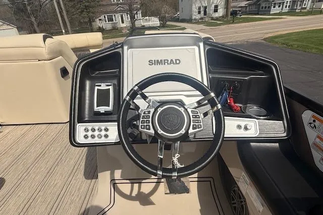 Slide: The Image of Steering console of 2021 Premier 250 Grand Majestic RF boat with Simrad display. - 8