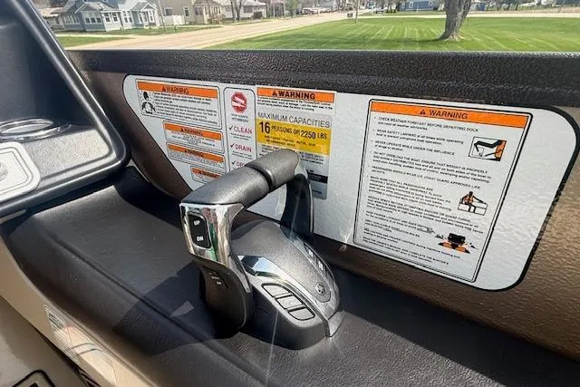 Slide: The Image of Control panel of a 2021 Premier 250 Grand Majestic RF boat with safety warnings. - 9
