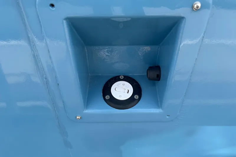 Slide: The Image of Blue ACB 30 (2003) fuel cap compartment with secure closure. - 5